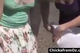 Lesbians kissing and fingering pussy at beach