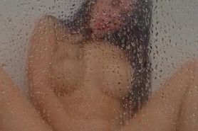 Latina is fingering in the shower