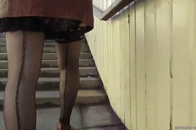 Sexy girl in seamed stockings going upstairs 2