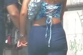 Hot asses in denim wiggling around the street candid video