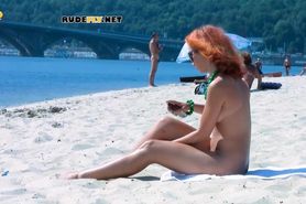 Hot nudist teen jumps in the water and swims to cool her body