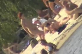 A horny voyeur loves filming hot nudity on the beach.
