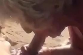 Spanish Granny sucking my young cock at the beach