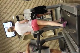 Hot blond girl on threadmill running with thong