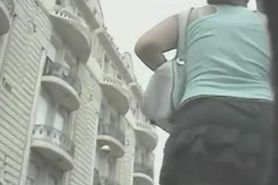 Enticing ass in a short skirt on an upskirt video