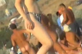 Naked hotties showing their pussies at the beach