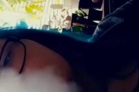 Goth stoner girl smoking a clove cigarette