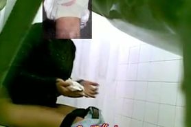 A fresh hottie is pissing in front of a toilet peeing spy cam