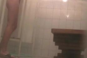 Fem with cool hips soaping skin on the shower cam