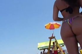 Delicious butt in thong on the beach !