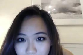 Hot Asian striptease and plays tiny pussy on cam