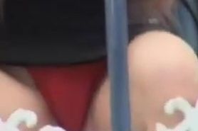 Sitting girl cute red panty up skirt in the close up AE53