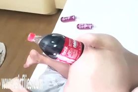 She invited her husband to help her with the Cola bottle