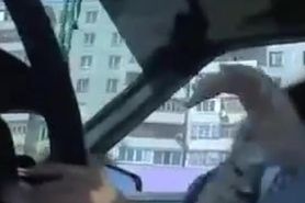 Man sitting in the car and playing with his member