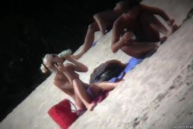 Nude beach blonde model being filmed by a voyeur
