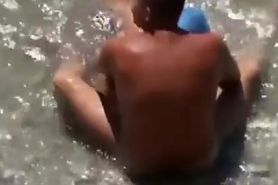 Woman blows her man's dick in the water
