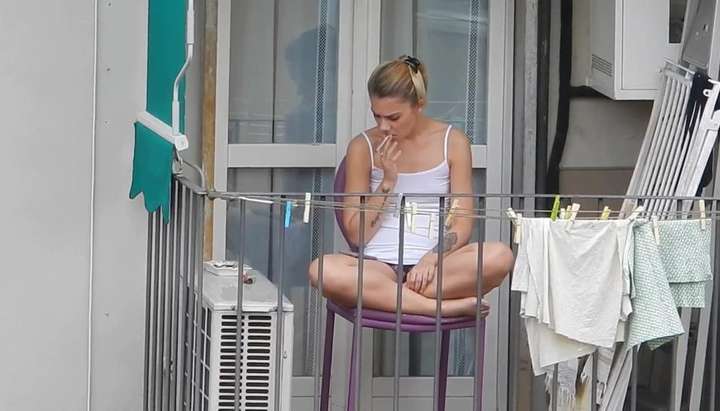 Candid blonde showing her feet on the fence in a way that reveals upskirt TNAFlix Porn Videos