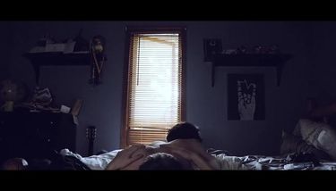 Horny couple fucking on a bed