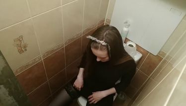 Hidden camera in toilet shoots girl masturbating cunt